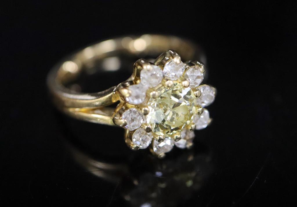 A modern 18ct gold and diamond cluster ring,
